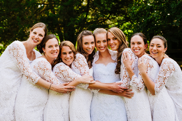 Lace wedding dress with bridesmaids